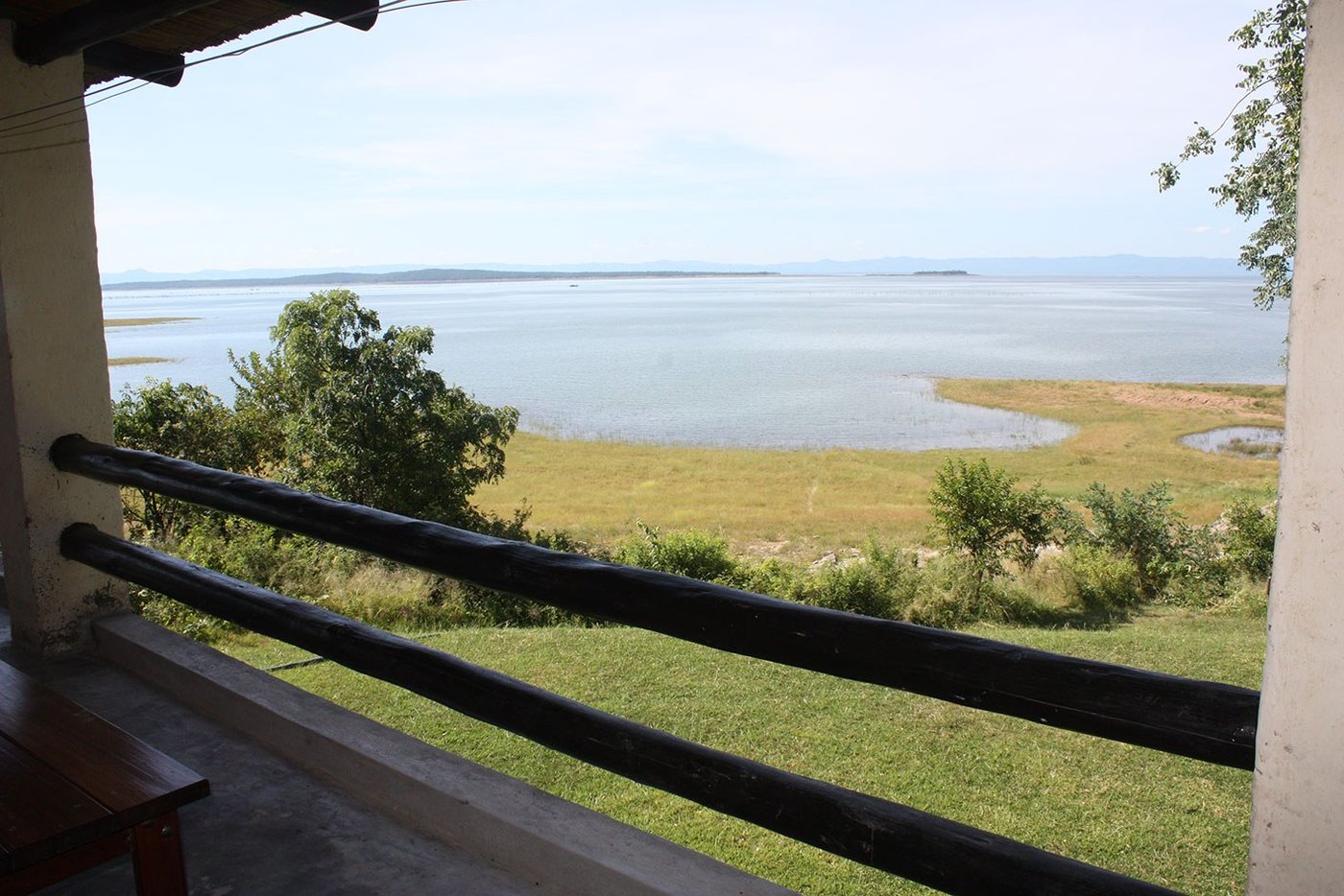 View over the lake and wetland grass from the veranda at Fisherman's Cove.