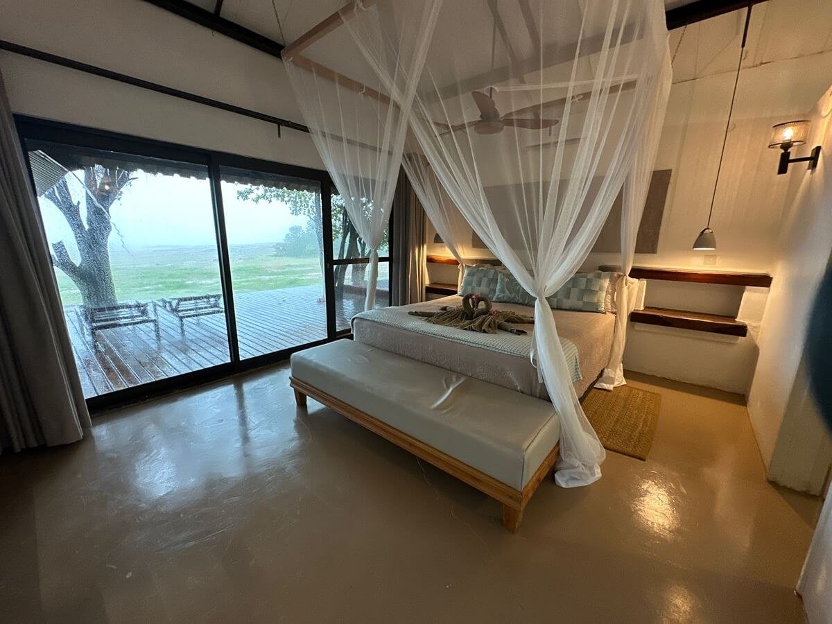 Bedroom with sliding glass doors opening onto a private deck at Spurwing Island.